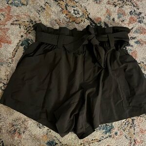 Athleta dark green shorts. Stretchy waist- can dress up and down. Size 4.